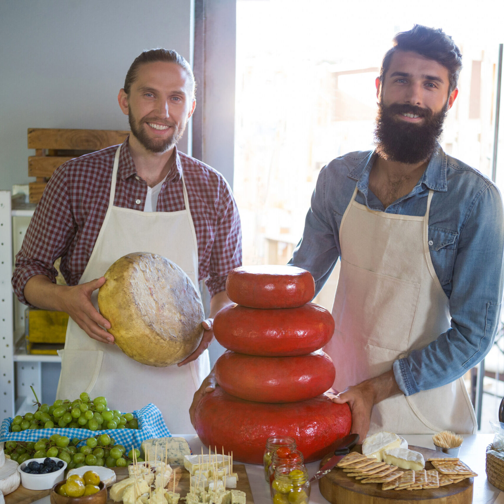 Portrait of smiling staff working at counter in market